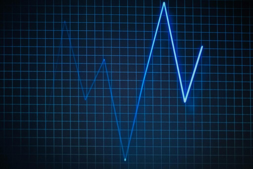 Elixir Batter Reverter ECG graph on a grid background symbolizing heartbeat and medical data.